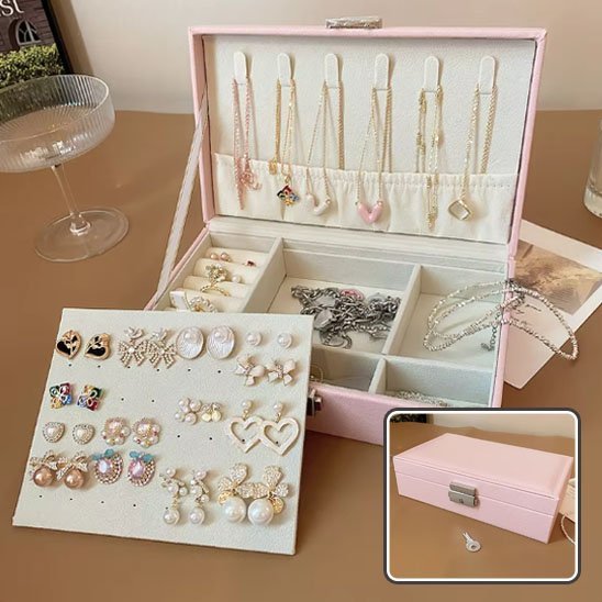 Boite à bijoux rose à multiples compartiments et sécurisée